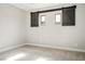 Bedroom featuring two windows with sliding barn door shutters and lots of light at 2176 De Narvik Dr, Henderson, NV 89044