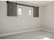 Bedroom featuring two windows with sliding barn door shutters at 2176 De Narvik Dr, Henderson, NV 89044