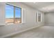 Bright bedroom with large windows and plantation shutters offering scenic neighborhood views at 2176 De Narvik Dr, Henderson, NV 89044