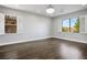 Bedroom with hardwood floors, shutters, and a chandelier at 2176 De Narvik Dr, Henderson, NV 89044