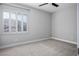 Bedroom featuring a window with plantation shutters and neutral paint at 2176 De Narvik Dr, Henderson, NV 89044