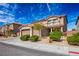 Charming two-story home with a two-car garage and well-maintained landscaping at 2176 De Narvik Dr, Henderson, NV 89044