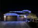 Charming home illuminated by colorful Christmas lights at night, showing curb appeal at 2176 De Narvik Dr, Henderson, NV 89044