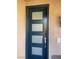 Modern front door with glass panels, a smart lock, and a doorbell at 2176 De Narvik Dr, Henderson, NV 89044