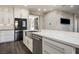 Kitchen island featuring a stainless steel sink, dishwasher, and a white marble countertop at 2176 De Narvik Dr, Henderson, NV 89044