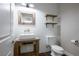 Farmhouse-style powder room with rustic wood vanity, vessel sink, wood shelves, and shiplap walls at 2176 De Narvik Dr, Henderson, NV 89044