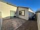 Backyard patio showcasing the home's exterior and air conditioning unit at 2241 Chandler Ranch Pl, Laughlin, NV 89029