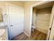 Cozy bathroom includes a white door, toilet, shower, and sink area at 2241 Chandler Ranch Pl, Laughlin, NV 89029