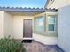 Inviting home entrance, featuring a brick-lined walkway, manicured landscaping, and a stylish front door at 2241 Chandler Ranch Pl, Laughlin, NV 89029