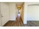 Bright hallway features wood-look floors leading to other rooms in the home at 2241 Chandler Ranch Pl, Laughlin, NV 89029