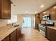 Well-lit kitchen features stainless steel appliances, granite countertops, and modern cabinets at 2241 Chandler Ranch Pl, Laughlin, NV 89029