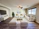 Bright living room featuring hardwood floors, white sofas, and modern decor at 2241 Chandler Ranch Pl, Laughlin, NV 89029