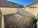 Private outdoor patio is fully fenced and features brick flooring at 2241 Chandler Ranch Pl, Laughlin, NV 89029