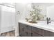 Modern bathroom featuring double sinks and a shower tub combination at 2493 Verdello St, Henderson, NV 89044