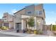 Charming modern home with a gray color scheme, modern garage door, and desert landscaping at 2493 Verdello St, Henderson, NV 89044