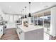 Modern kitchen with white cabinets, quartz countertops, and stainless steel appliances at 2493 Verdello St, Henderson, NV 89044