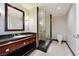 Bathroom with glass shower, granite vanity and marble tile flooring at 2700 Las Vegas Blvd # 1604, Las Vegas, NV 89109