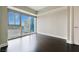 Bright bedroom featuring hardwood floors and a large window offering an expansive city view at 2700 Las Vegas Blvd # 1604, Las Vegas, NV 89109