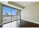 Bedroom with hardwood floors features floor to ceiling windows with city views at 2700 Las Vegas Blvd # 1604, Las Vegas, NV 89109
