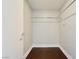 Walk-in closet features hardwood floors and a chrome closet rod at 2700 Las Vegas Blvd # 1604, Las Vegas, NV 89109