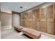 This spacious locker room is equipped with full wooden lockers and comfortable seating with leather benches at 2700 Las Vegas Blvd # 1604, Las Vegas, NV 89109