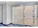 Modern indoor squash court with glass doors, hardwood flooring, and bright lighting at 2700 Las Vegas Blvd # 1604, Las Vegas, NV 89109