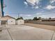 Spacious backyard featuring two storage sheds at 2712 Royal St, North Las Vegas, NV 89030