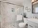 Updated bathroom featuring a glass-enclosed shower, modern vanity, and stylish tile work at 2712 Royal St, North Las Vegas, NV 89030