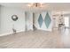 Bright living room featuring neutral paint, hardwood floors, and modern lighting at 2712 Royal St, North Las Vegas, NV 89030