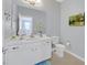 Well-lit bathroom featuring a white vanity, modern fixtures, and a clean design at 3037 Villanelle Ave, Henderson, NV 89044