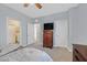 Bright bedroom with neutral walls, carpet, and multiple entryways at 3037 Villanelle Ave, Henderson, NV 89044