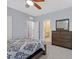 Comfortable bedroom featuring a wooden dresser and a doorway to an adjoining bathroom for added convenience at 3037 Villanelle Ave, Henderson, NV 89044