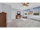 Light-filled bedroom showcasing two beds, a wooden dresser, and a view to the backyard at 3037 Villanelle Ave, Henderson, NV 89044