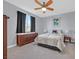 Serene bedroom with neutral walls, dark drapes, and natural light at 3037 Villanelle Ave, Henderson, NV 89044