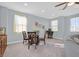 Cozy dining area features a round table, carpeted floors, and natural light at 3037 Villanelle Ave, Henderson, NV 89044