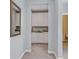 Hallway view with linen storage and natural light flowing into the bathroom for added convenience at 3037 Villanelle Ave, Henderson, NV 89044