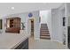 Hallway view into the pantry featuring an upper stairway with carpeted steps to the second floor at 3037 Villanelle Ave, Henderson, NV 89044