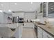 This bright kitchen has stainless steel appliances, ample counter space and modern pendant lighting fixtures at 3037 Villanelle Ave, Henderson, NV 89044