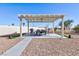 Backyard pergola featuring a table and chairs plus a built-in grill at 3109 Bangor Ct, Las Vegas, NV 89134