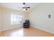 Cozy bedroom with a leather chair and lots of light at 3109 Bangor Ct, Las Vegas, NV 89134