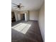 Spacious bedroom with carpet flooring, ceiling fan, and ample natural light at 3177 Rabbit Creek Dr, Las Vegas, NV 89120