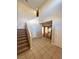 Bright entryway featuring tile floors and a staircase leading to the upper level of the home at 3177 Rabbit Creek Dr, Las Vegas, NV 89120