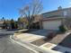 Two-story home featuring an attached two-car garage, desert landscaping, and a concrete driveway at 3177 Rabbit Creek Dr, Las Vegas, NV 89120