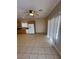 Kitchen and casual dining area featuring tile floors, a ceiling fan, and white appliances at 3177 Rabbit Creek Dr, Las Vegas, NV 89120