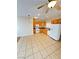 Kitchen and casual dining area featuring tile floors, a ceiling fan, and white appliances at 3177 Rabbit Creek Dr, Las Vegas, NV 89120