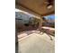 Covered patio featuring concrete flooring with backyard and rock landscape at 3177 Rabbit Creek Dr, Las Vegas, NV 89120