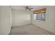 Carpeted bedroom featuring a ceiling fan and window at 3412 Winterhaven St # 101, Las Vegas, NV 89108