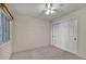 Bright bedroom features neutral carpet, a window with blinds, and closet with sliding doors at 3412 Winterhaven St # 101, Las Vegas, NV 89108