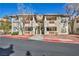 Charming condo building featuring well maintained landscaping, private balconies, and convenient stair access at 3412 Winterhaven St # 101, Las Vegas, NV 89108