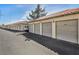 Row of private residential garages offering convenient parking with unit numbers for easy identification at 3412 Winterhaven St # 101, Las Vegas, NV 89108